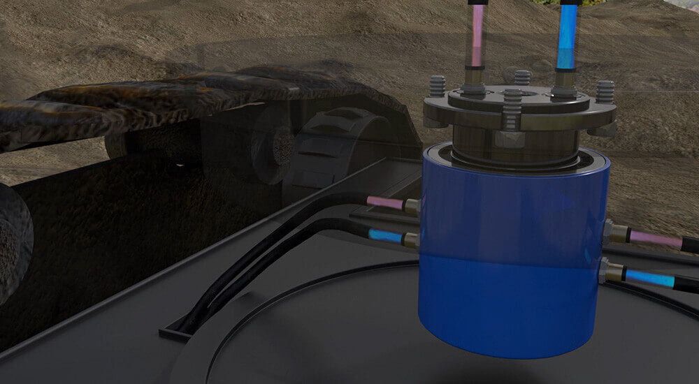 Pressurized hydraulic fluid transfers through the rotary union to power the track drive system